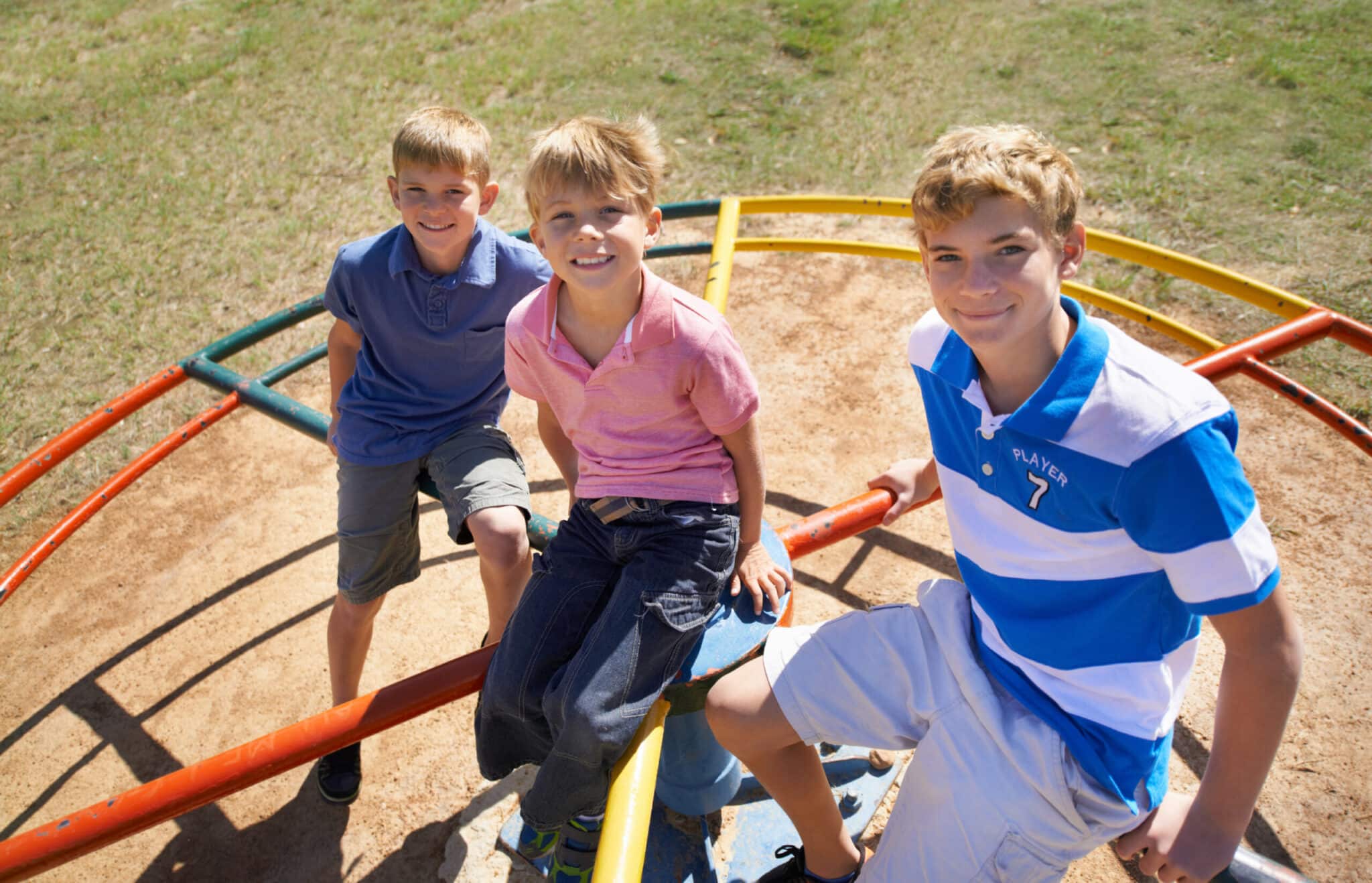 Brothers playing on a playground at howling hills